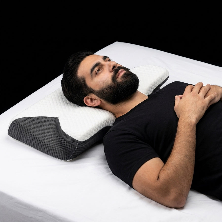 A man lying on the contour pillow for the first time, awake
